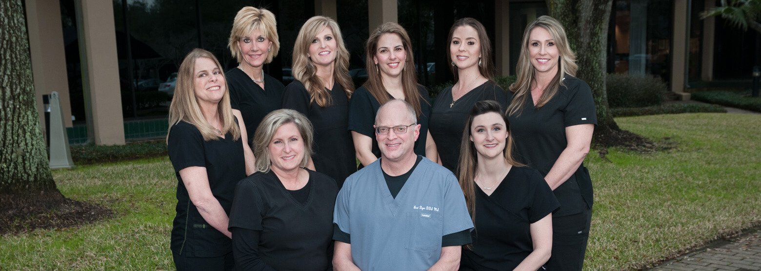 Outside group photo with Dr. Dyer and his staff at Fort Bend Periodontics and Implantology